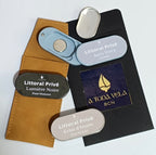 Colección completa de perfumes sólidos Litoral Privé: Aura Terra (unisex), Lumière Noire (hombre) y Éclat d'Ivoire (mujer), lujo natural hecho en Barcelona.
