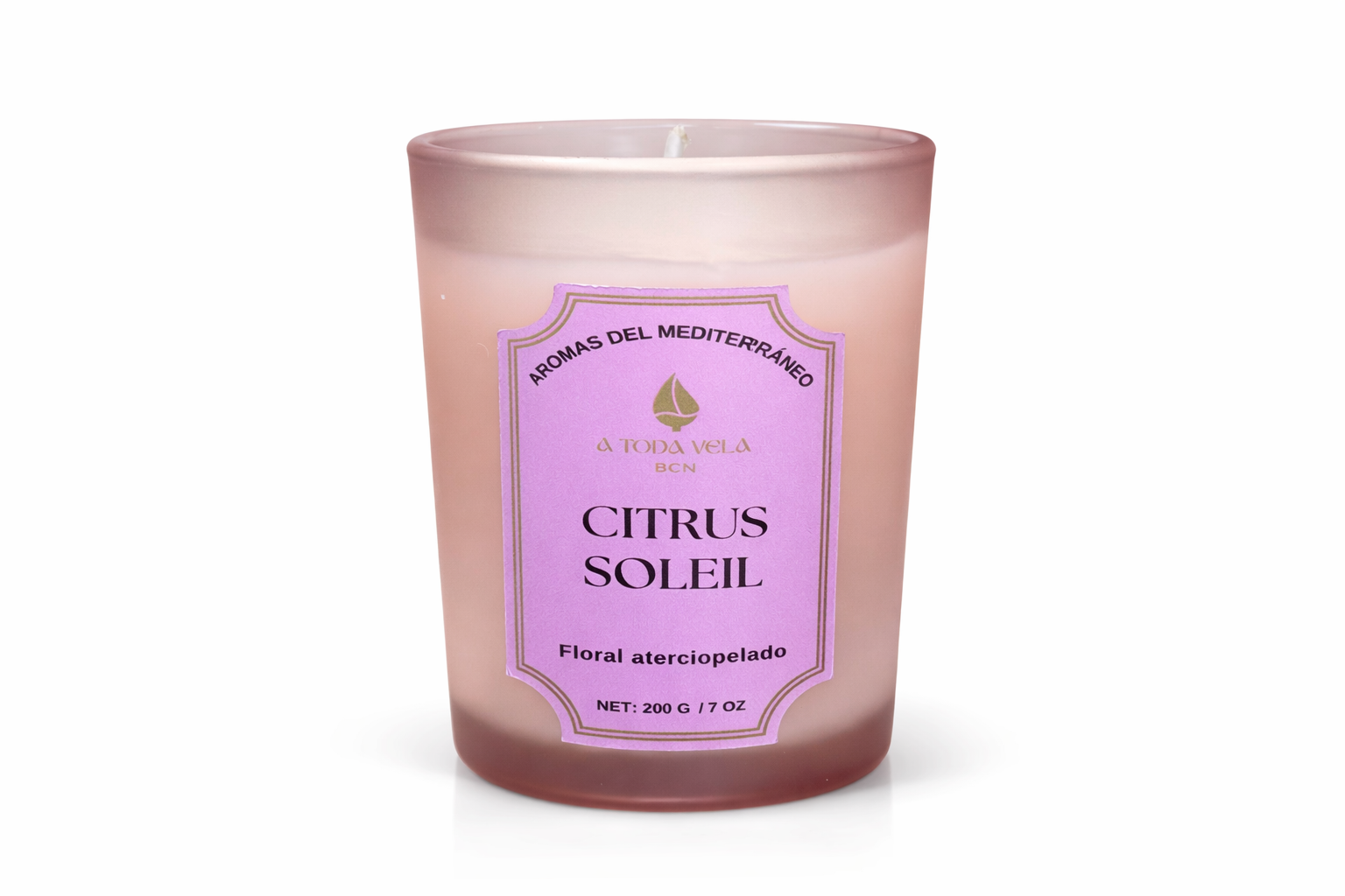 Vela aromática de lujo Citrus Soleil de la colección Aromas del Mediterráneo en vaso de cristal, aroma cítrico luminoso y diseño elegante.