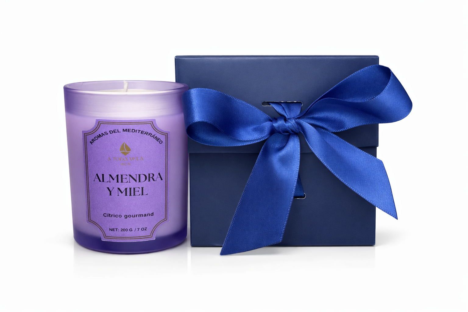 Vela aromática Almendra y Miel presentada en estuche de regalo azul, vela de lujo inspirada en el Mediterráneo ideal para decoración y obsequio premium.